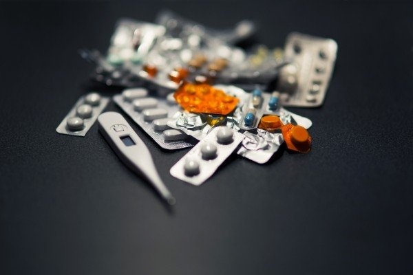 medicines-and-thermometer-on-black-background.jpg